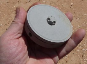 an M969 mine held in my hand